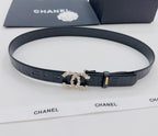 Chanel belt, dark blue, laid flat; embossed strap with gold buckle and jeweled clasp