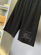 Black Burberry shorts with embroidered graphic on the lower leg