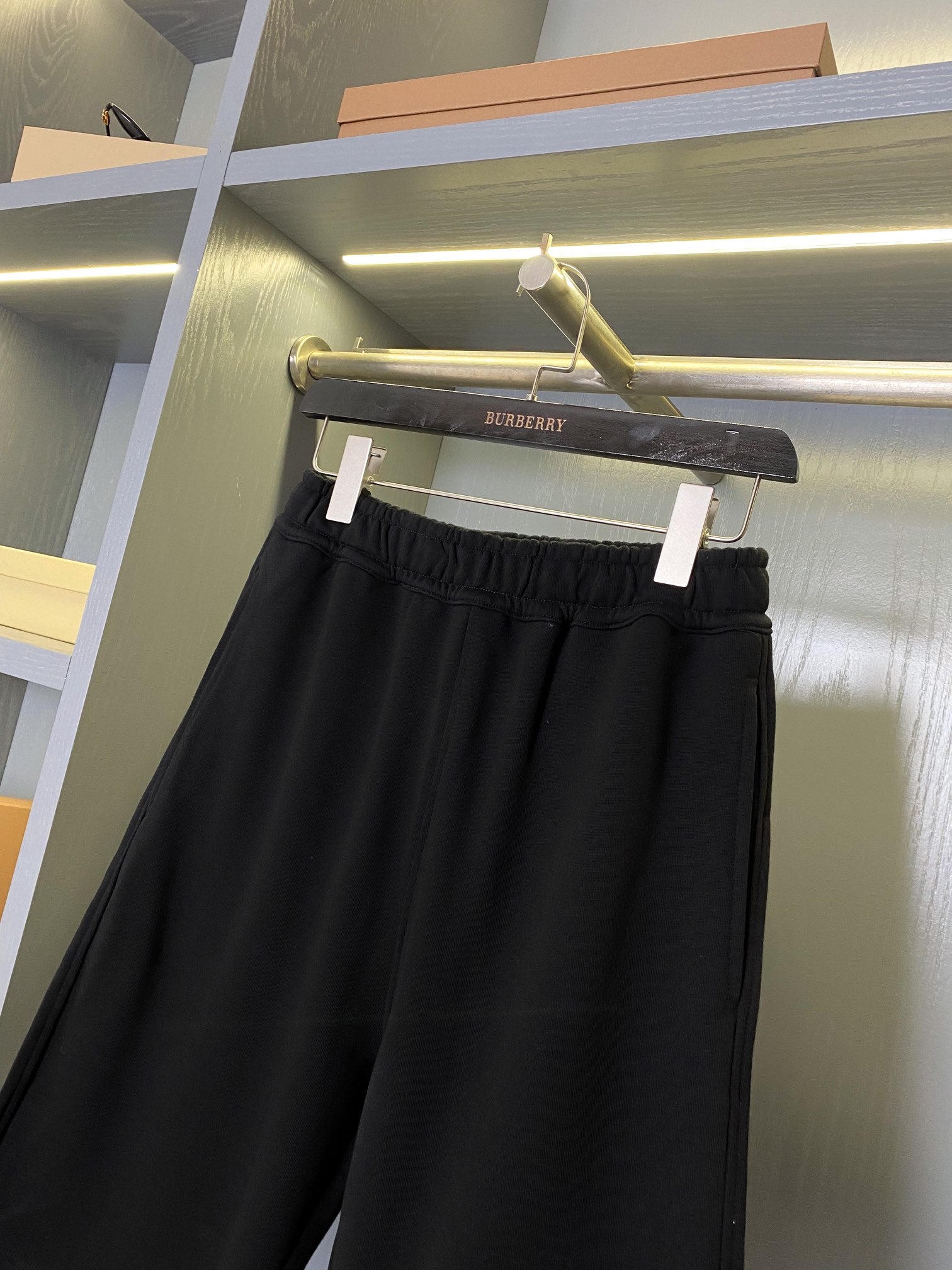 Black Burberry shorts with gathered elastic waistband, front view