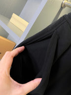 Black Burberry shorts with side pleats and elastic waistband