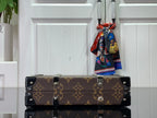 Louis Vuitton monogram bag with black end panels and silver stud accents