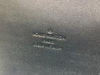 Louis Vuitton embossed logo on brown monogram leather