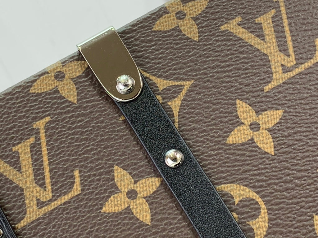 Louis Vuitton monogram bag strap tab with black leather patch and silver rivets
