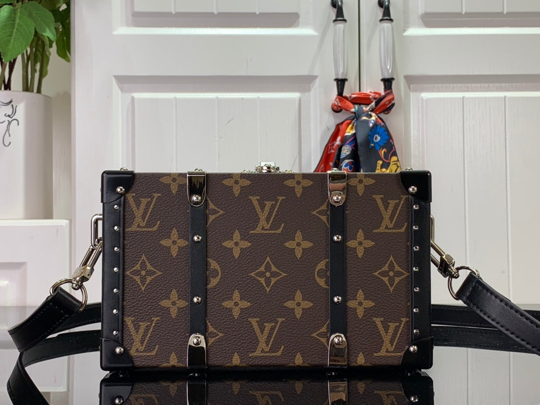 Louis Vuitton monogram bag with black straps and silver-stud trim
