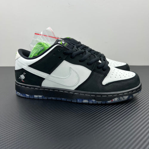 Nike Dunk SB Low Pro sneakers in black and white with green accents