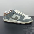 Light blue and white low-top sneakers with Nike swoosh and white lace-up