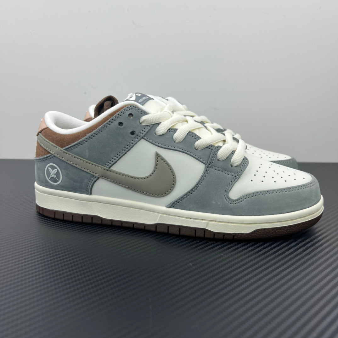 Light blue and white low-top sneakers with Nike swoosh and white lace-up