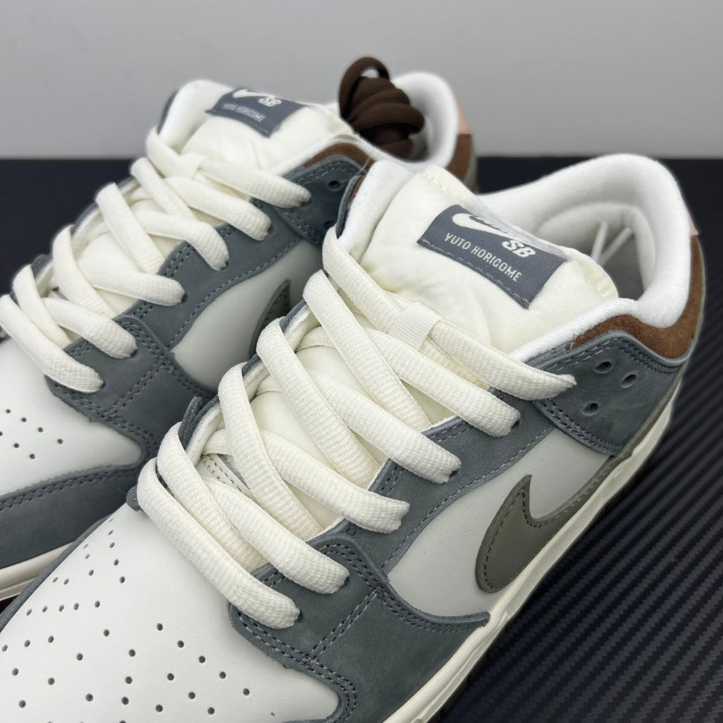 Tongue and laces detail on light blue and white low-top sneakers