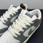Tongue and laces detail on light blue and white low-top sneakers