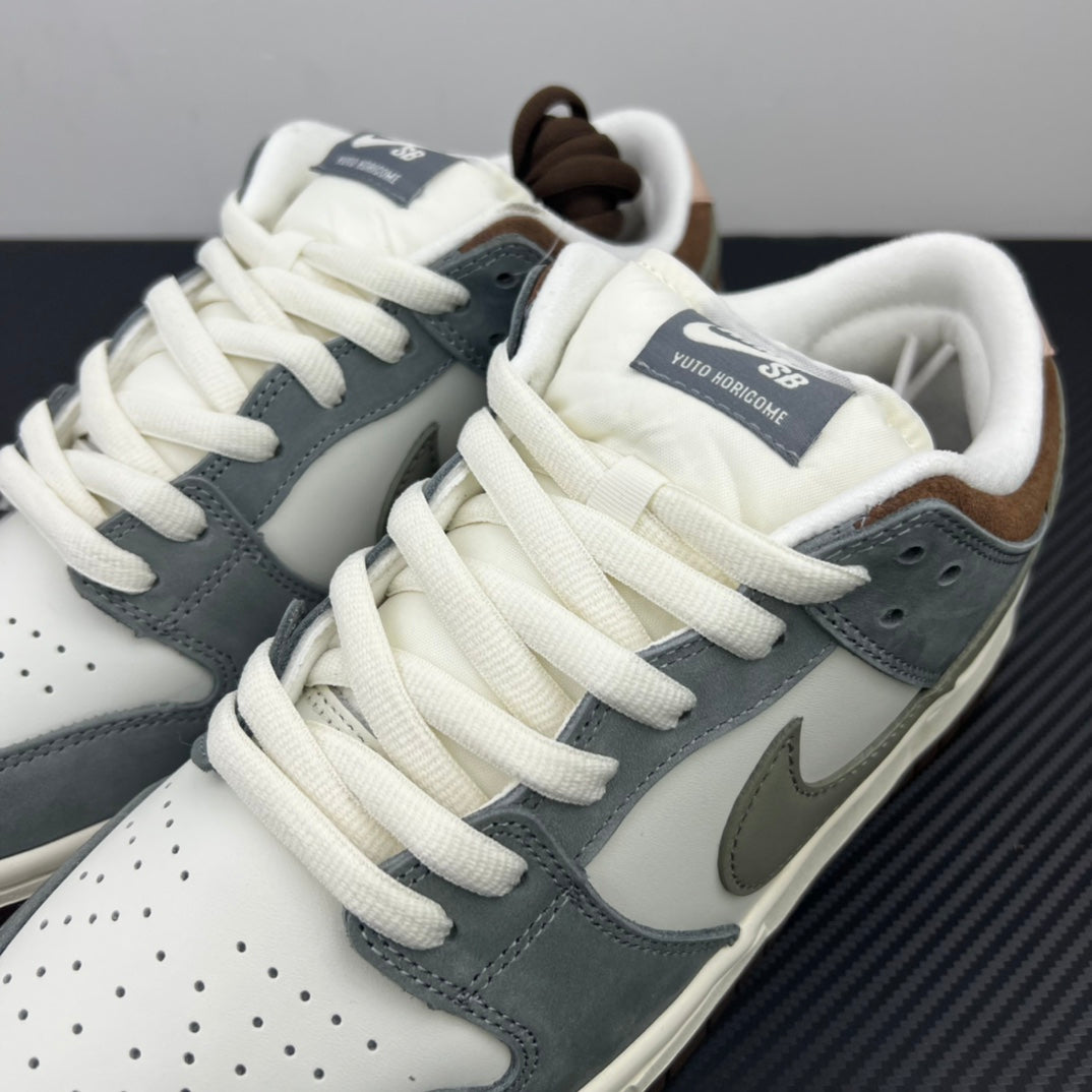 Tongue and laces detail on light blue and white low-top sneakers