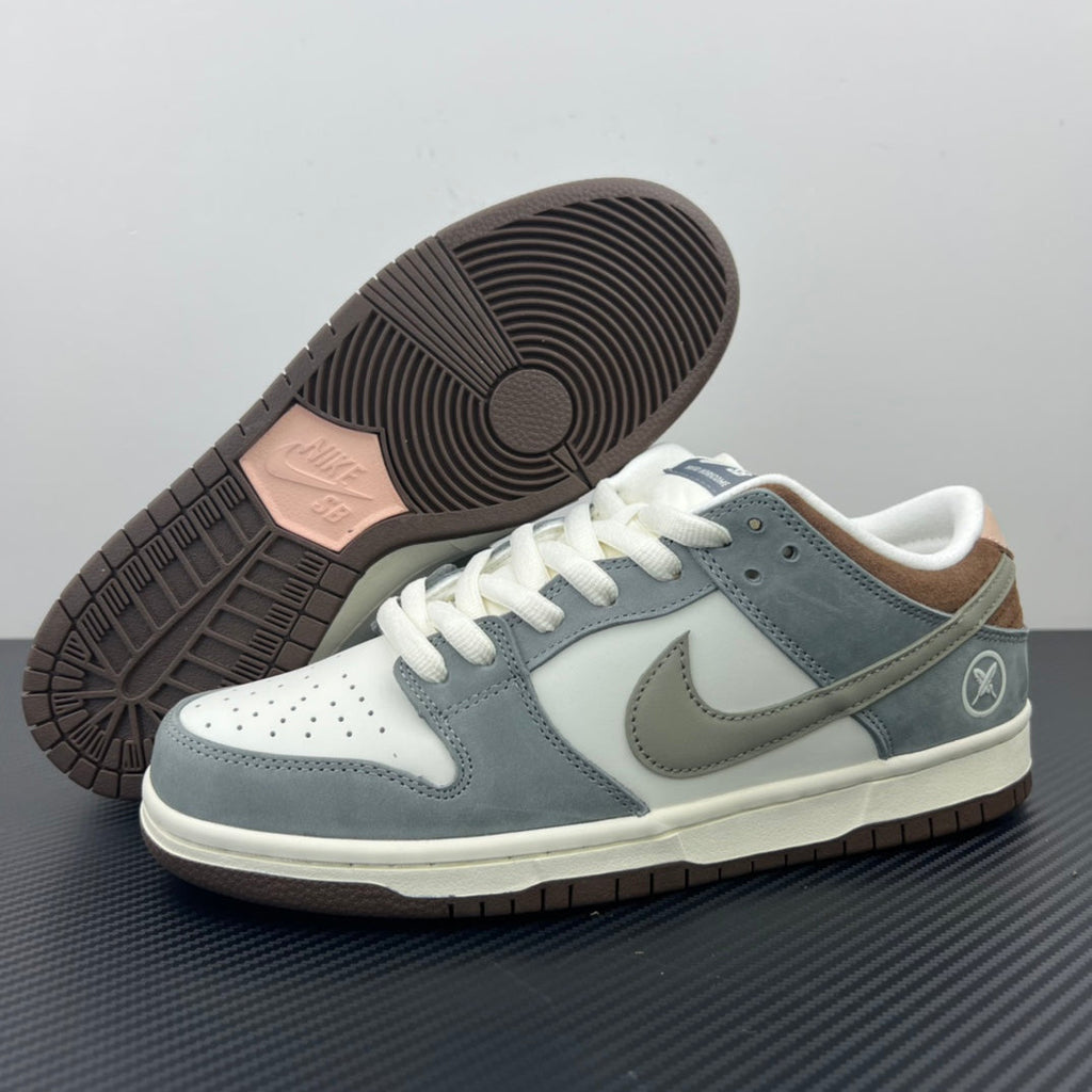 Low-top sneakers outsole view with brown traction tread and cream midsole