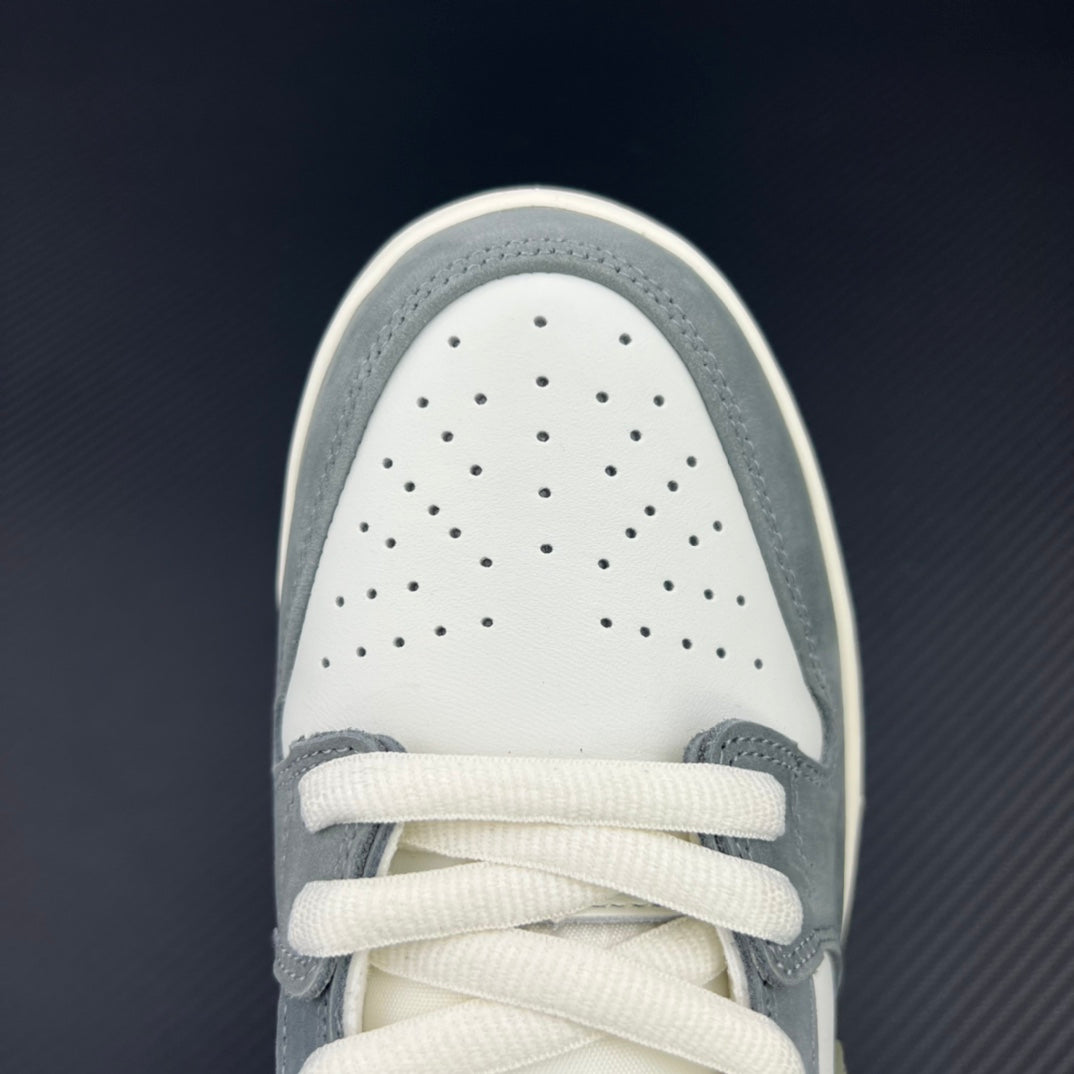 White perforated toe box with white laces on light blue low-top sneakers