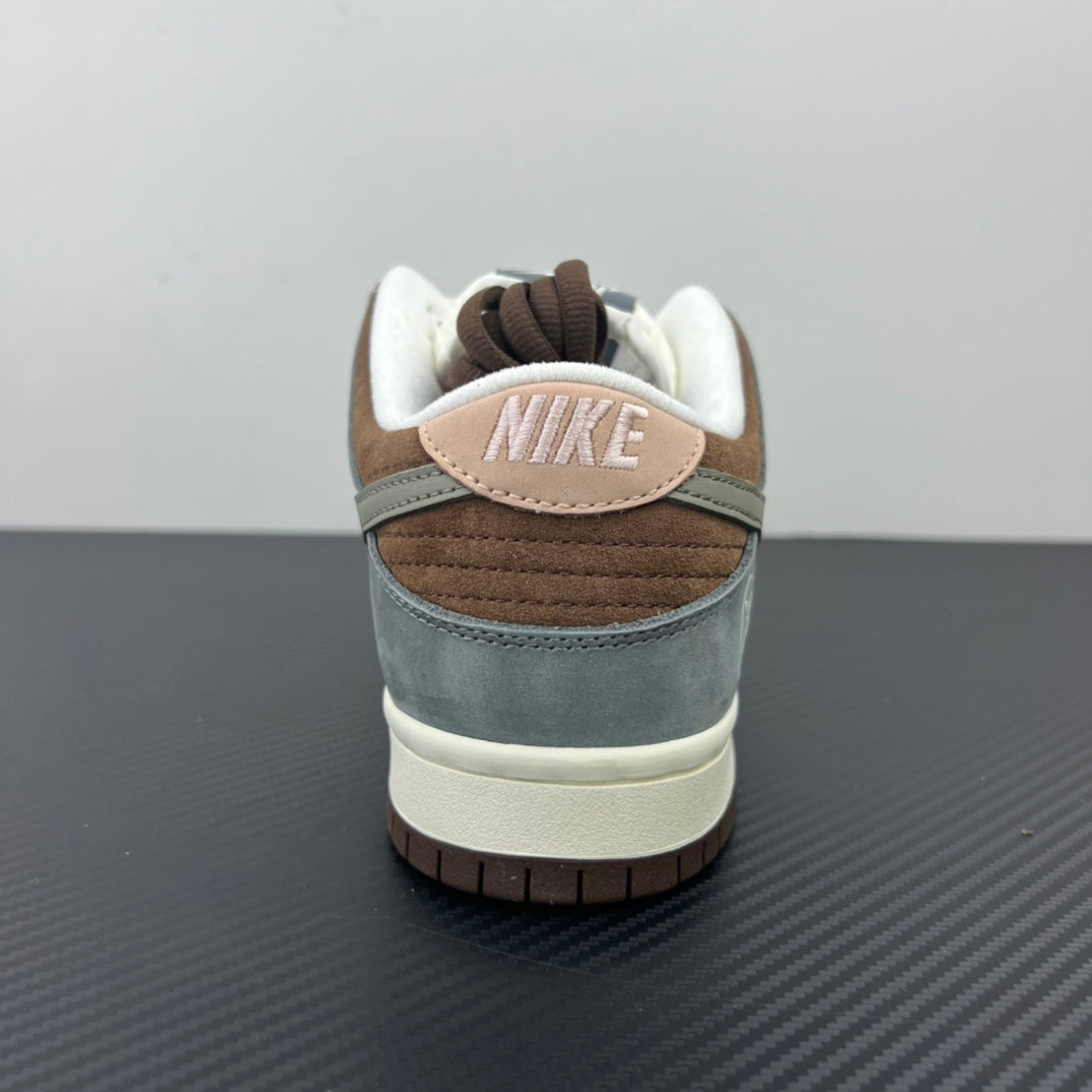 Back view of light blue and brown low-top sneakers with white laces and NIKE heel tab