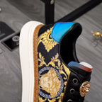 Versace sneakers detail, black with gold baroque pattern and blue leather heel panel