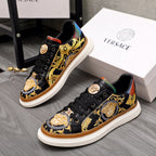 Versace sneakers, black leather with gold baroque print and round gold logo on laces