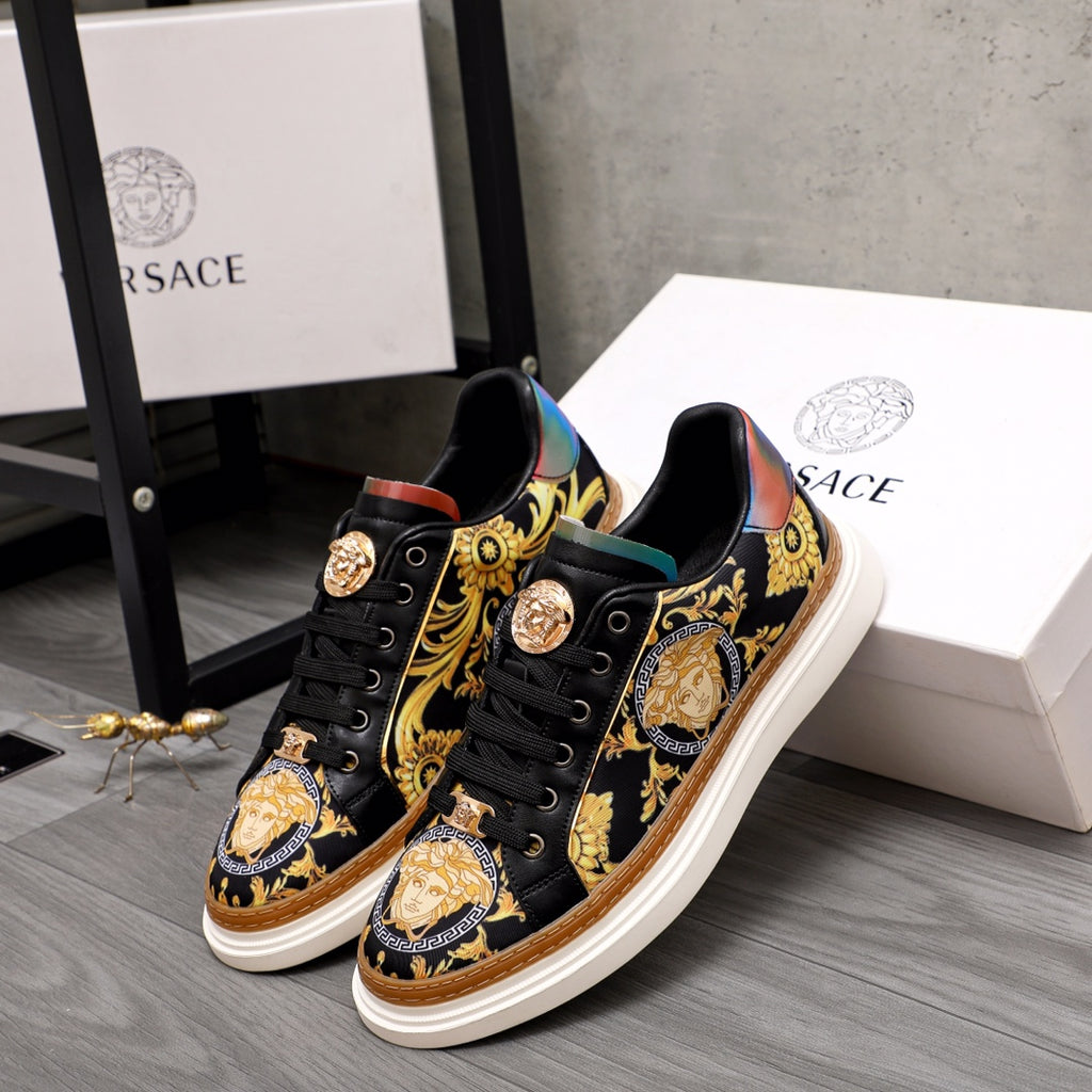 Versace sneakers pair, black leather with gold baroque print and multicolor heel accents