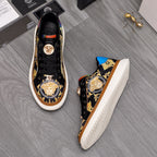 Versace sneakers, black with gold baroque logos and blue heel panel, side view