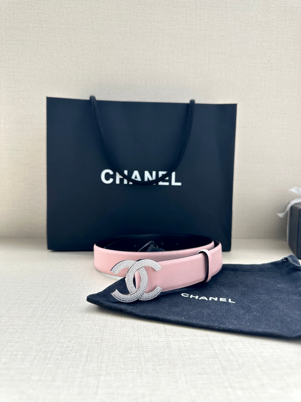 Chanel pink leather belt with silver CC buckle centered on strap