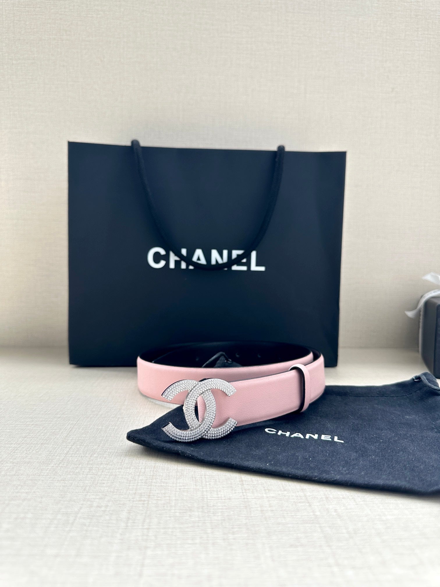 Chanel pink leather belt with silver CC buckle centered on strap