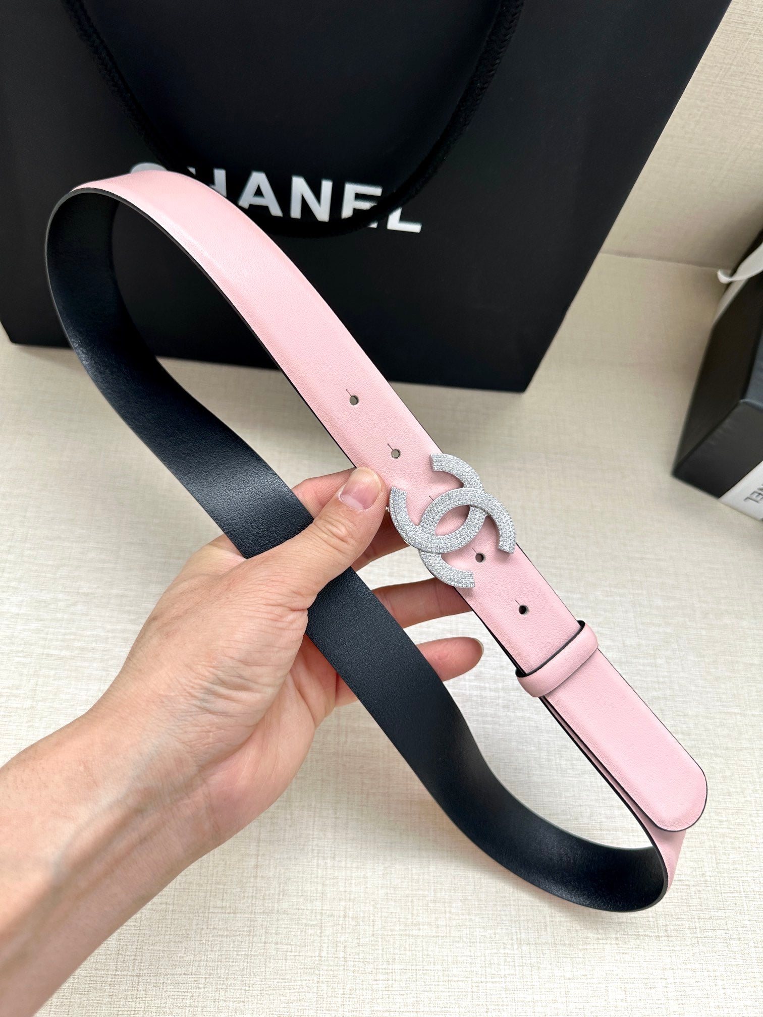 Chanel pink leather belt with silver CC buckle and visible eyelets