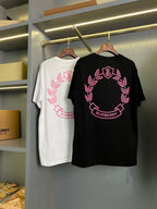 Black short-sleeve T-shirt with pink laurel wreath and B logo graphic
