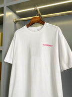White short-sleeve T-shirt with small pink Burberry logo on chest, crew neck