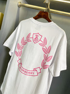 White short-sleeve T-shirt with large pink Burberry wreath graphic, crew neck