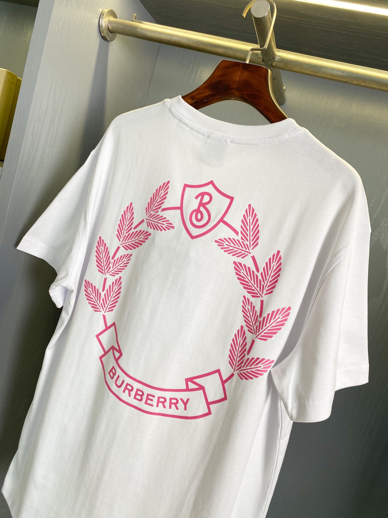 White short-sleeve T-shirt with large pink Burberry wreath graphic, crew neck