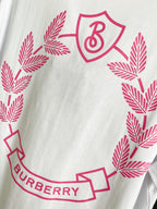 White short-sleeve T-shirt close-up of pink leaf wreath and Burberry logo