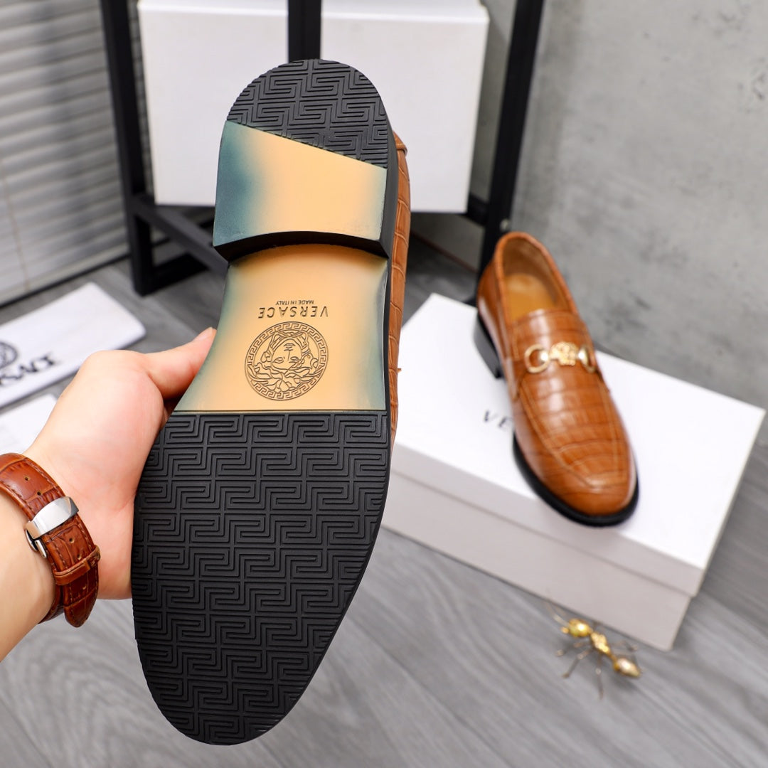 Versace luxury shoes, outsole view of brown loafer with textured traction pattern