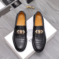 Men's Versace black leather loafers with embossed texture and gold crest buckle