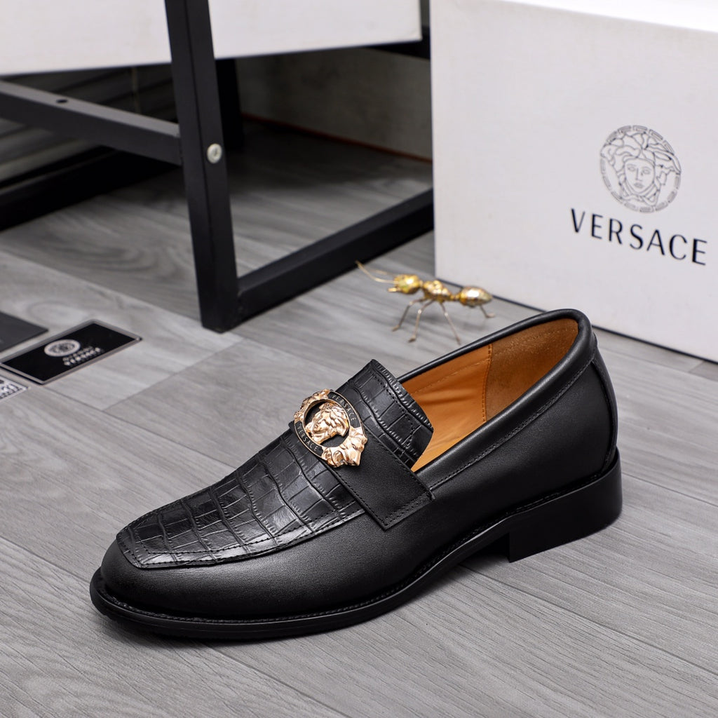 Men's Versace black leather loafers with gold medallion buckle on textured strap
