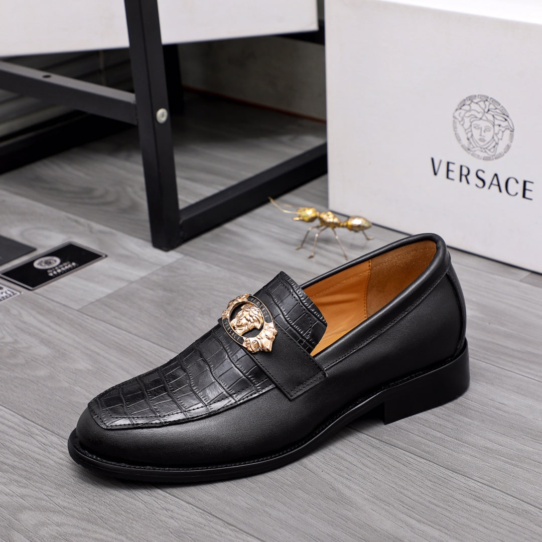 Men's Versace black leather loafers with gold medallion buckle on textured strap