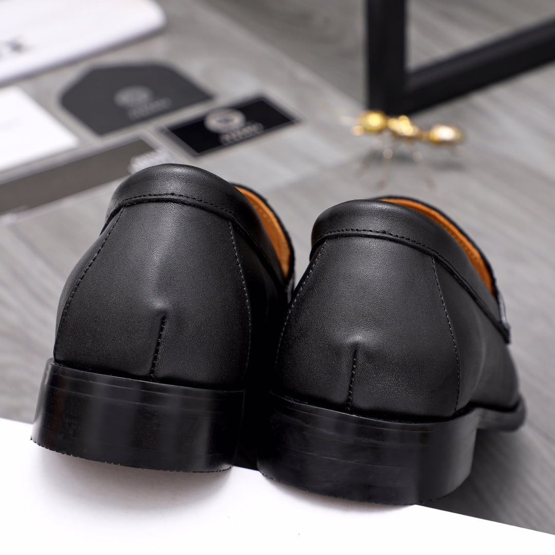 Men's Versace black leather loafers from back, rounded heel and tan lining
