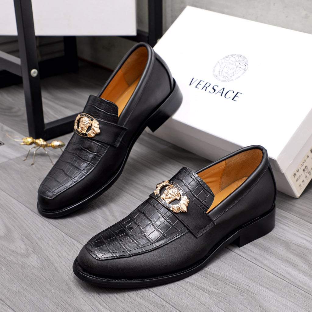 Men's Versace black leather loafers with gold crest detail and textured upper
