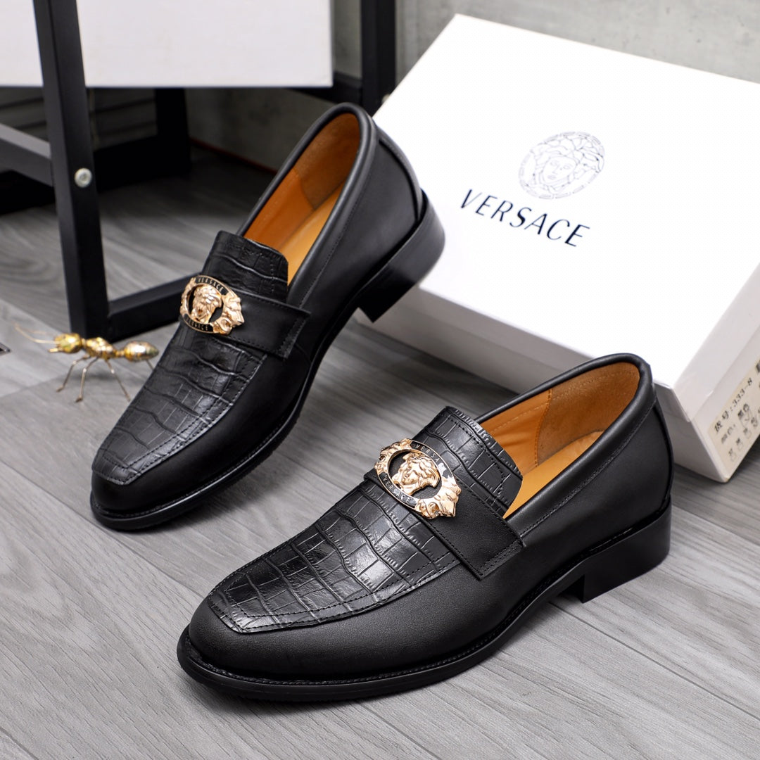 Men's Versace black leather loafers with gold crest detail and textured upper
