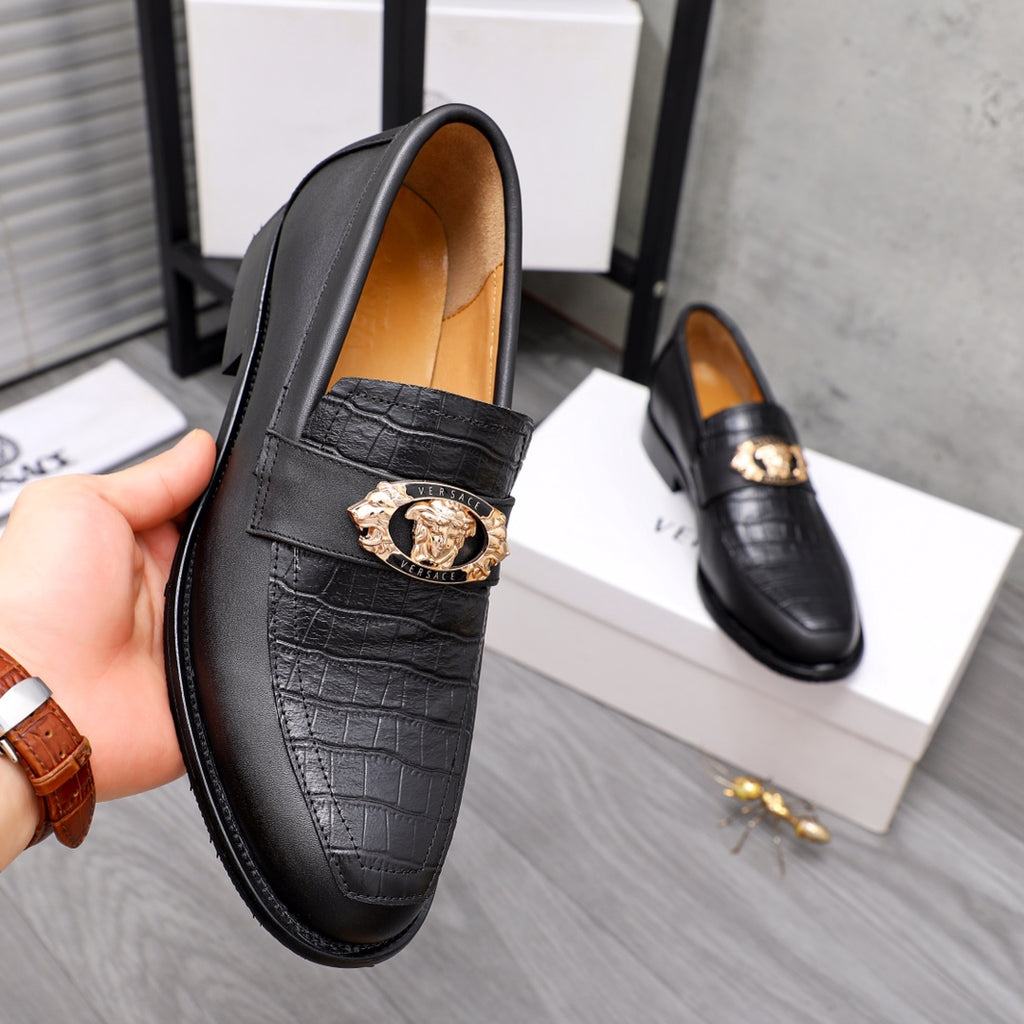 Men's Versace black leather loafer with gold crest buckle and embossed side panel