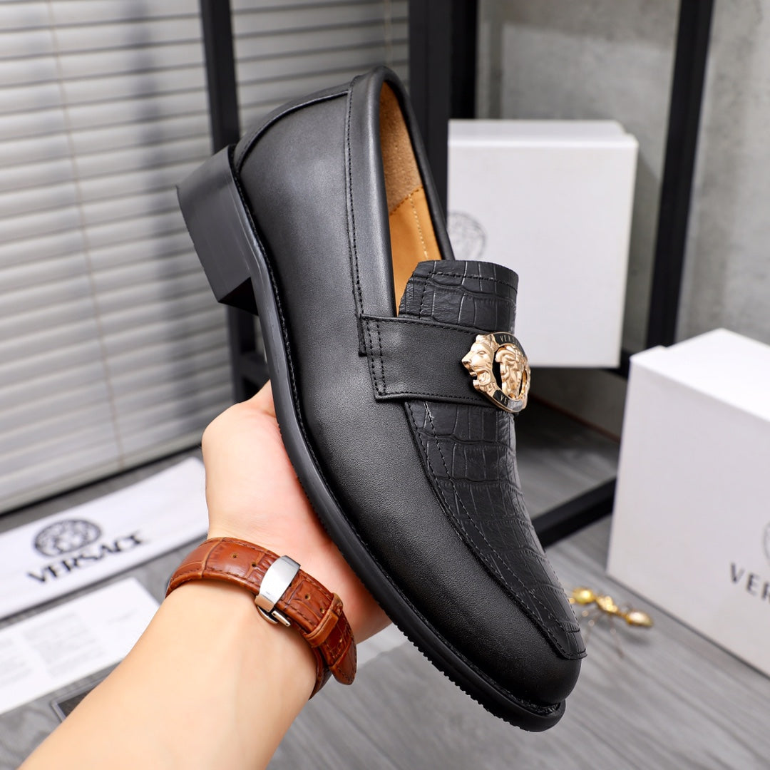 Men's Versace black leather loafer with gold crest buckle and embossed strap