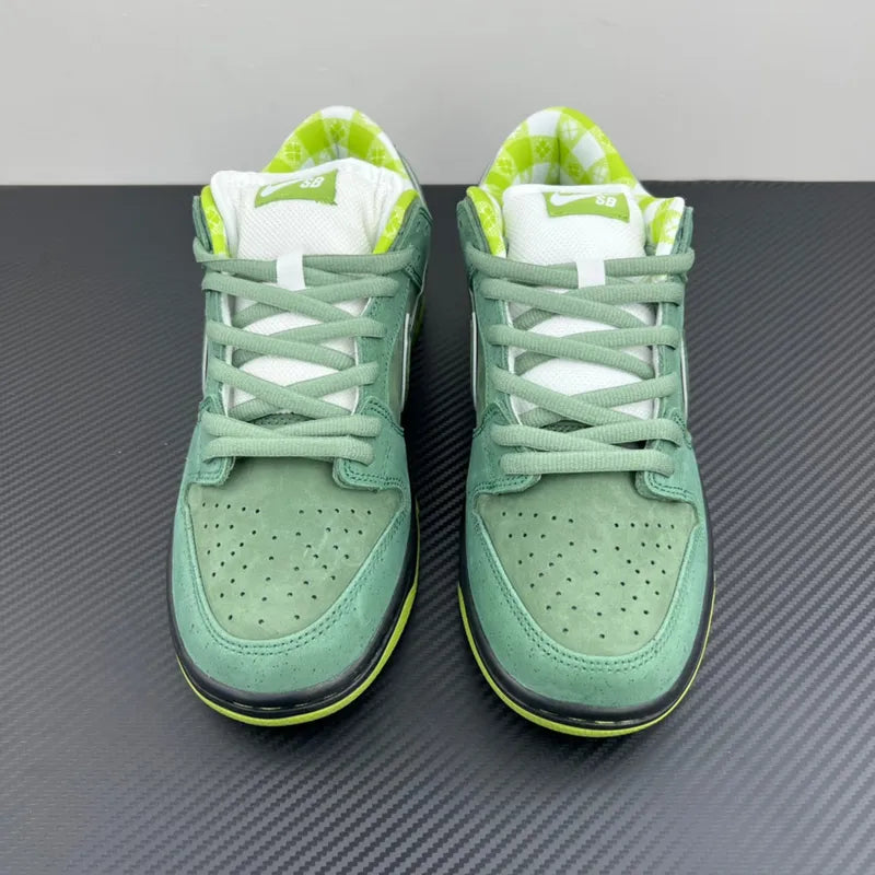 Green and white low-top Nike SB Dunk sneakers with green laces and black sole