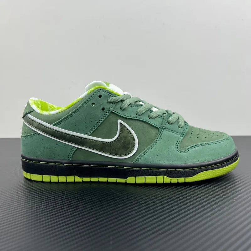 Side profile of green Nike SB Dunk low-top sneakers with white Swoosh and lime sole