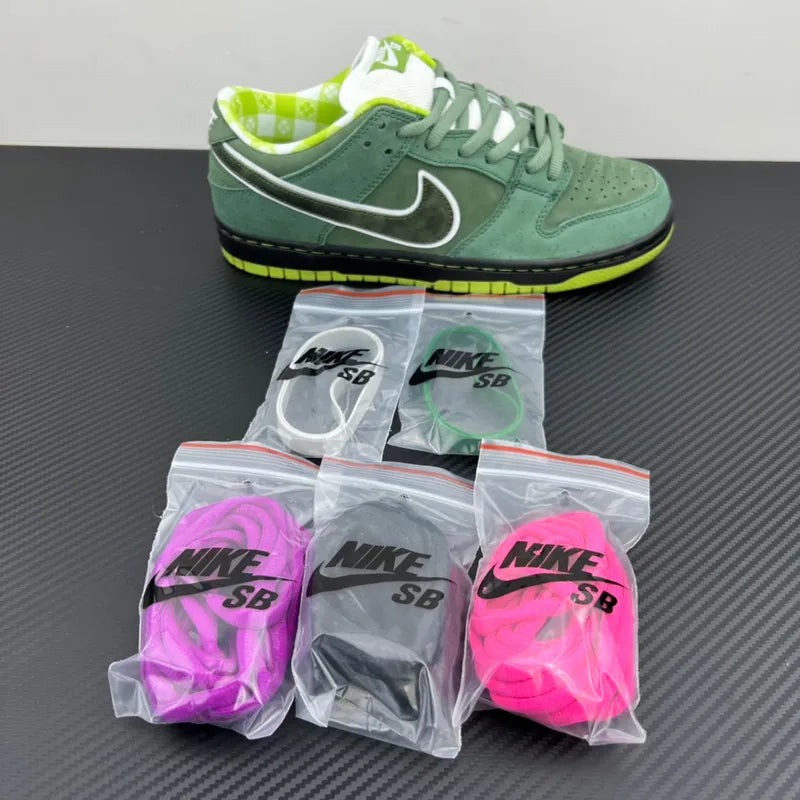 Nike SB Dunk low-top sneaker with boxed replacement laces in purple, black, and pink