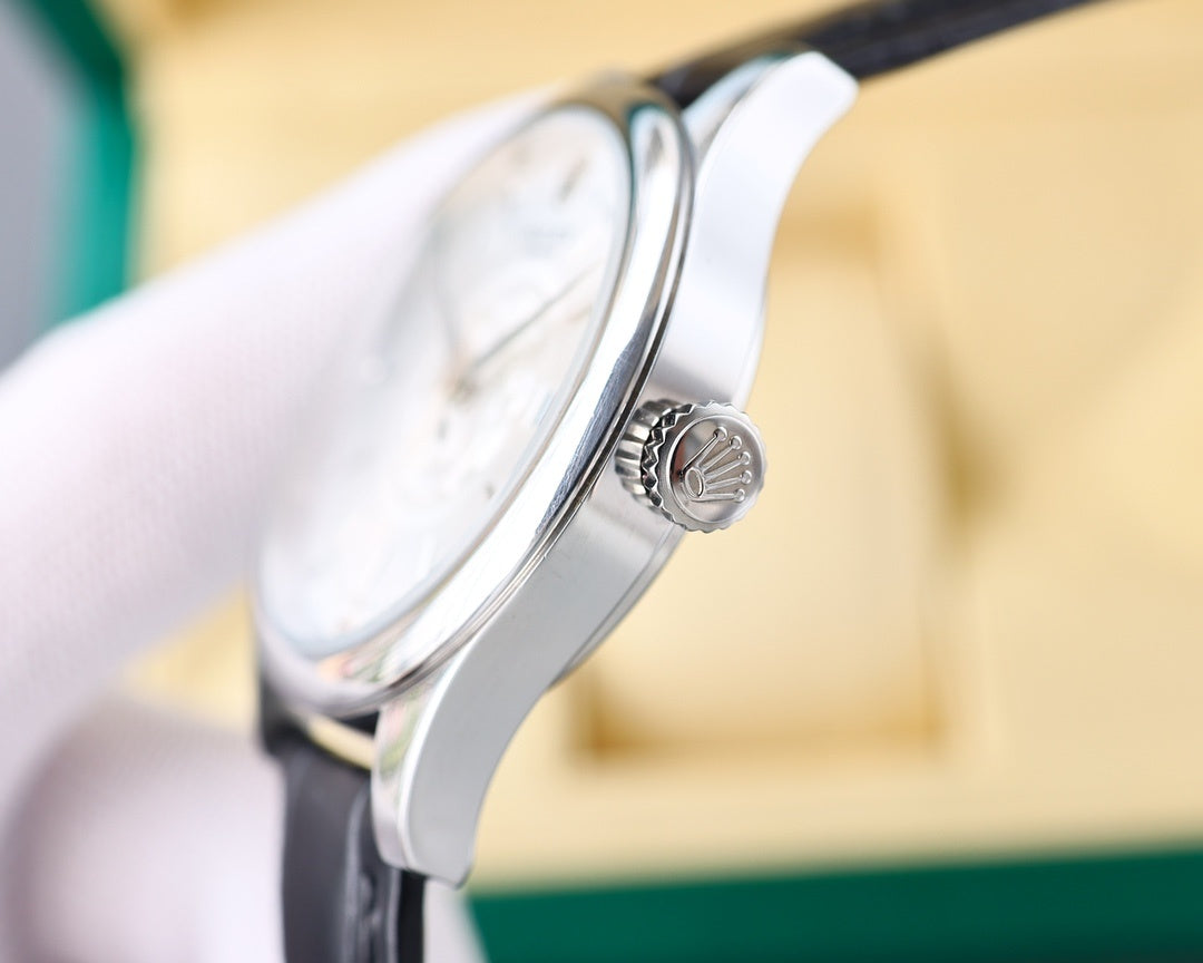 Rolex watch side with crown and ridged bezel, black leather strap