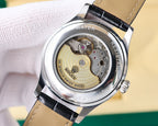 Rolex watch case back with visible movement, black leather strap