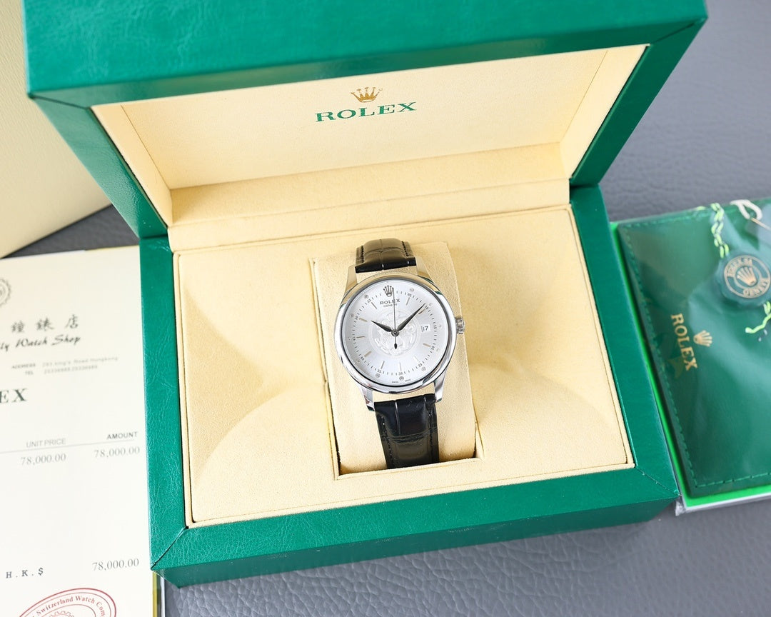 Rolex watch in presentation box, black leather strap, silver case, white dial