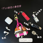 Small Louis Vuitton bag with brown monogram, pink accents, hanging charms and zipper