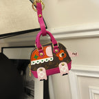 Small Louis Vuitton mini bag with brown monogram, pink handles and front patch details