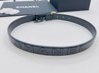 Chanel belt with dark navy strap and large HANDEL lettering buckle plate