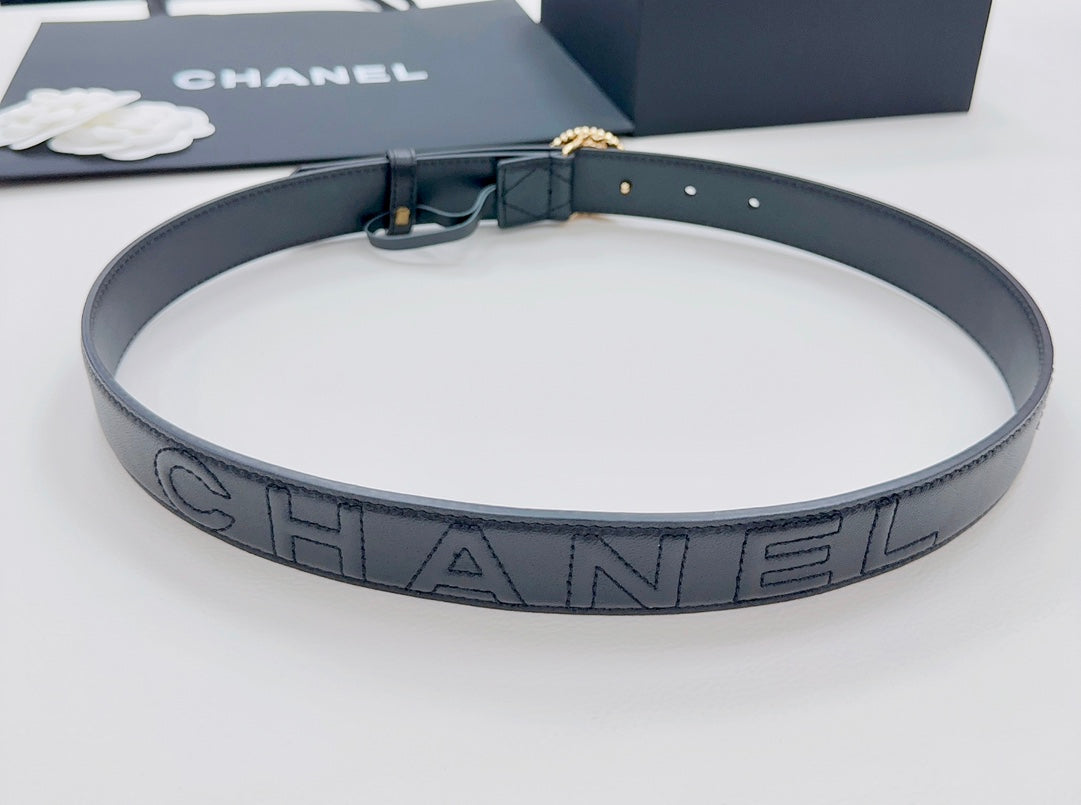 Chanel belt with dark navy strap and large HANDEL lettering buckle plate