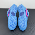 Low-top sneakers showing light-blue patterned outsoles with pink side accents.