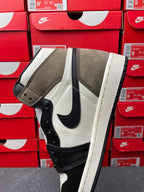 High-top sneakers, angled side view, white leather with dark navy/black swoosh and suede toe